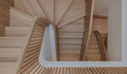 Figure and Studio J Jih perform “stair gymnastics” inside Boston rowhouse